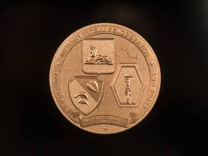 Medal honoring Lily (Kobayashi) Terao's service to Military Intelligence, received by her sons, David and Donald.